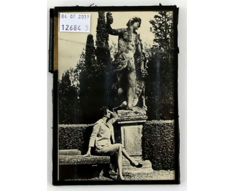 Cecil Beaton portrait photograph of Violet Trefusis seated on the terrace of Villa dell'Ombrellino. 10 x 15 cm.Violet Trefusi