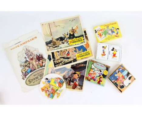 Disney - Snow White and The Seven Dwarfs campaign book, ceramic plaque, six wax figures, 3 Pinocchio front of house cards, Di