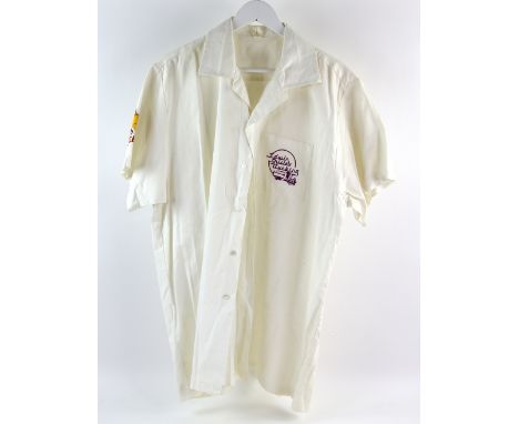 Queen - The Magic Tour. A rare white short sleeve cotton short produced for only the road crew by Edwin Shirley Trucking (Que