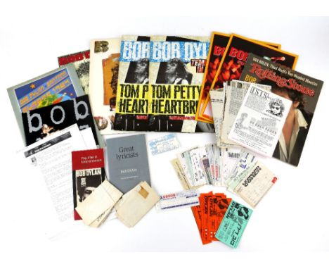 Bob Dylan memorabilia including 8 tour programmes, over 25 tickets to various concerts, stage song lists and other items..   