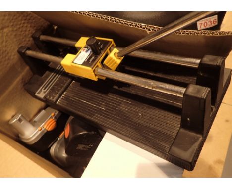 Box of cordless drills and other tools
