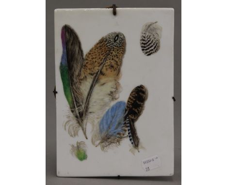 A Victorian porcelain panel painted with feathers. 16 x 23 cm.