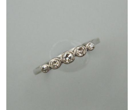 A platinum five stone diamond ring. Ring Size N/O.