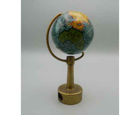 A vintage novelty pencil sharpener formed as a globe. 9 cm high.