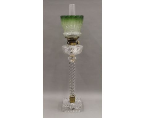 A Victorian twisted clear glass oil lamp with etched glass shade, possibly by Osler of Birmingham. 83 cm high overall.