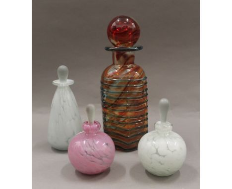 A Mdina glass decanter, signed; together with three perfume bottles with stoppers. The former 25.5 cm high.