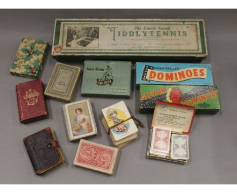 A quantity of vintage playing cards and games.