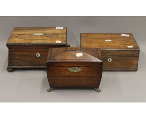 Two 19th century rosewood sewing boxes and a tea caddy. The largest 30 cm wide.