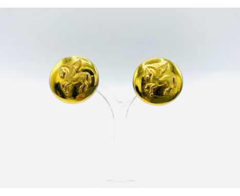 Pair of Hermes gold plated 'Pegasus' clip on earrings, 2.5cm diameter. Estimate: £60-80