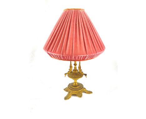 An ormolu Egyptian revival table lamp, 31cms. Estimate £20-40.