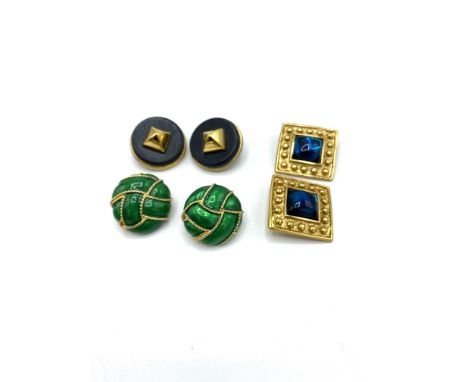 Pair of Yves St Laurent gold plated earrings with blue glass cabochon, 3.3cm x 3.3cm; pair of gold tone earrings with green e