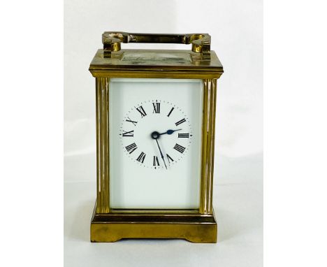 A brass cased carriage clock with enamel face and bevel edged glass, 8 x 6 x 13cm. Estimate: £30-50