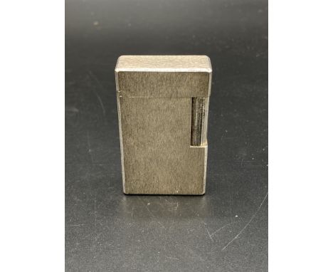 Dupont silver plate lighter in original box. Estimate: £30-50