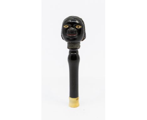 A rare 18th century carved ebony pipe tamper, with turned bone screw off cap for housing a metal pipe cleaner. The naive carv