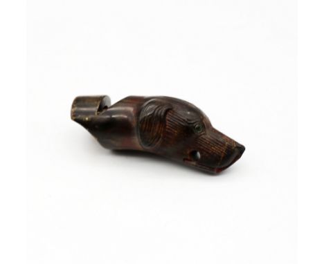 A 19th century carved horn whistle in the shape of a hunting hound's head, holes to mouth for cord and carved mouthpiece, app