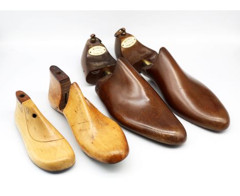 A pair of 20th century vintage 'Wildsmith of St James's, London' dark treen shoe trees, each approx. 32.2cm long, along with 