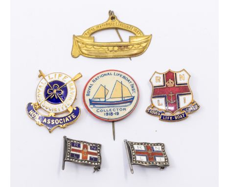 A group of six pin badges relating to the Royal National Lifeboat Institution (RNLI) to include two sterling silver backed en