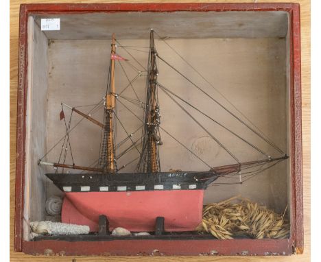 A late 19th / early 20th century cased model of a fully rigged ship, named ‘Annie’. Featuring a black and red painted model, 