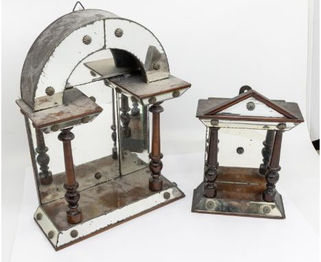 A 19th century mahogany mirror mounted dome topped architectural wall hanging display stand, with twin turned mahogany pillar