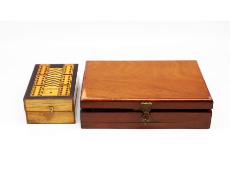 An early to mid 20th century cased gaming counter set consisting of five separate compartments for various sized stained bone
