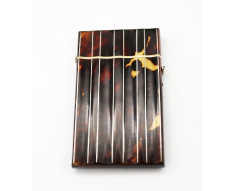 A 19th century tortoiseshell card case, of ribbed rectangular form, with ivory trim and push button hinge, white metal plate 