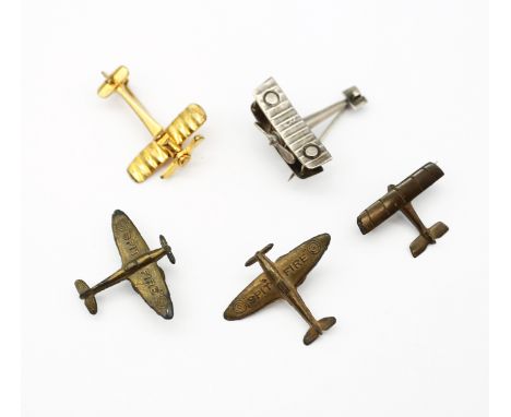 A selection of WW1, and WW2 fighter plane badges or brooches. To include: a circa WW1 sterling silver bi-plane, marked ‘RdNo5