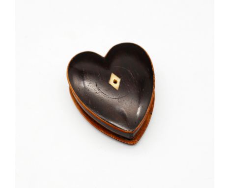 A 19th century heart shaped snuff box, dark stained mahogany with lighter edging and ivory diamond shaped escutcheons to cent