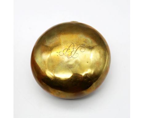 An early 19th century brass combination table tobacco or snuff box, of spherical form with naïve sun and moon design to hinge