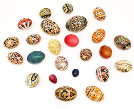 A collection of mixed hand painted eggs, 20th century vintage, various designs including geometric or vibrant, probably India