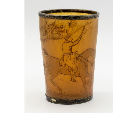 Hunting interest: A 19th century carved horn beaker, with hunting scenes depicting riders on horseback and hounds, with white