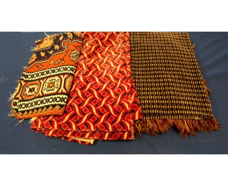 An Eastern European mid-20th century woven rug with a zig-zag design in narrow panels and a motif with burgundy background, t