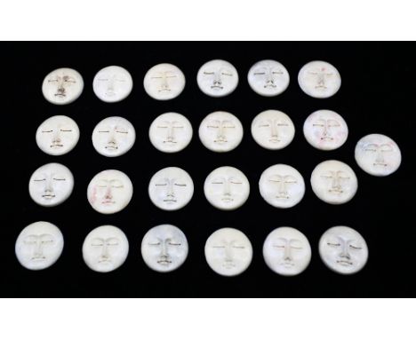 A collection of 25 vintage carved bone sleeping face cabochons, or sometimes known as moon faces. All approximately the same 