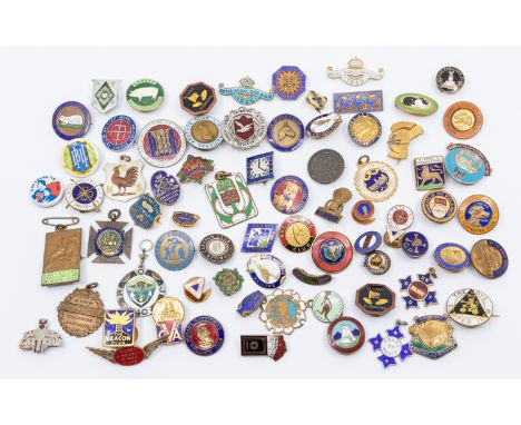 A large assortment of enamel and metal pin badges comprising of; G. Tutill of London, Workers of the World Unite, white ename