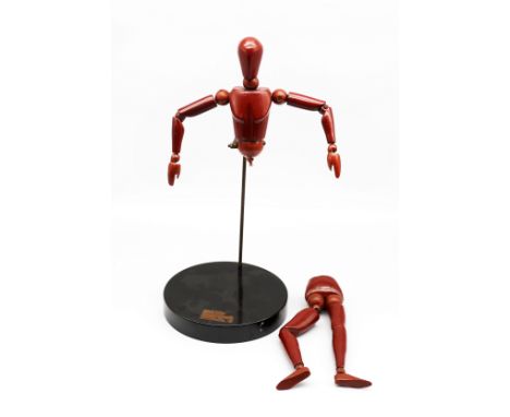 A 20th century 'Homunculos' bakelite / earlier plastic jointed artists model / mannequin, red colourway and on original circu