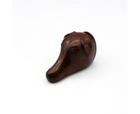 A late 18th/early 19th century mahogany snuff box in the form of a dog's head, small glass eyes, the rear of the head with hi