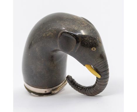 A 19th century novelty snuff mull, carved in the shape of an elephant's head and trunk, with bone eyes and tusks, the top wit