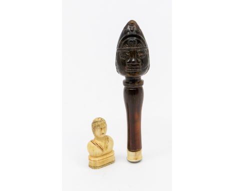 A scarce 18th century Scottish regimental carved horn pipe tamper and cleaning rod. The carved head has traces of painted hig