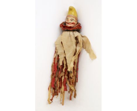 An early 20th century papier-mache novelty jester / punch marotte, detailed painted head and hat, attached on long wooden sti