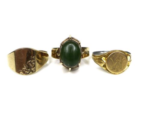 A group of three gold rings, comprising a 9ct gold vintage design ring with a jade cabochon in high eight claw setting, size 