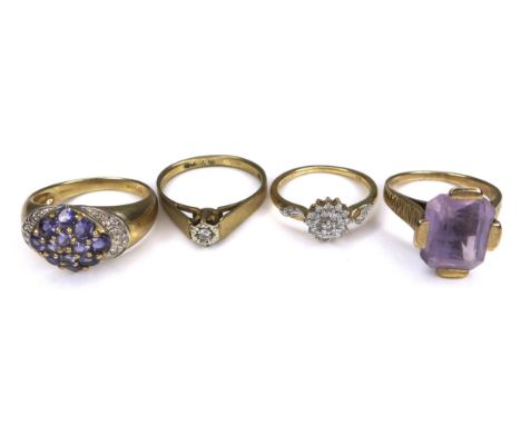 A group of 9ct gold rings, comprising a vintage design ring set with an emerald cut pale purple stone, 11.5 by 10.0 by 6.5mm,