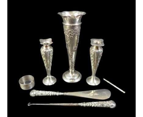 A group of silver, comprising  three spill vases with weighted bases, a swizzle stick, a shoe horn and a boot hook both with 