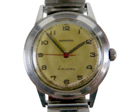 A Garrard / P. Buhre stainless steel gentleman's wristwatch, circa 1957, circular champagne dial, luminous Arabic markers, re
