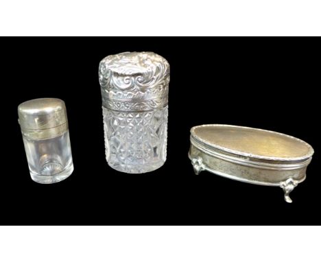 Three Victorian silver topped dressing table bottles, comprising an Edwardian cylindrical form silver topped dressing table j