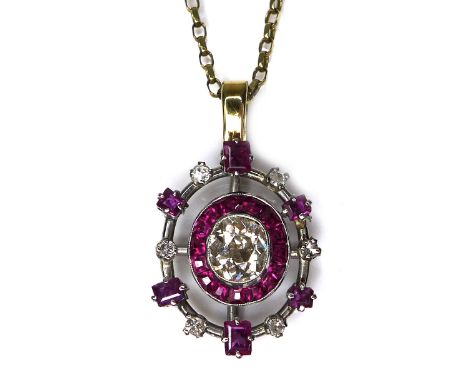 A diamond and ruby pendant, formed of a central old oval cut diamond, 6.1 by 5.3 by 3.4mm, approximately 0.68ct, surrounded b