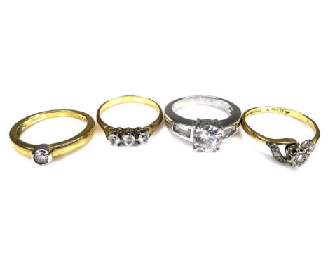 A group of four rings, comprising an 18ct yellow gold diamond solitaire ring, set with a 0.1ct, 3.0mm, brilliant cut stone, s