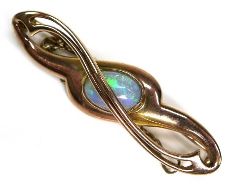 A 9ct gold and opal bar brooch, the stone an oval cabochon of approximately 8.5 by 5mm, the brooch itself of crossover design