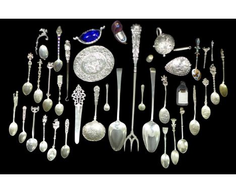 A collection of assorted British and continental silver and white metal flatware, including a Victorian oval form pin dish wi