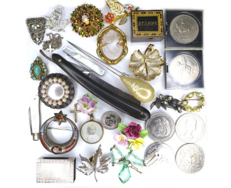 A small group of costume jewellery, including brooches, some silver and cameo, necklaces, a silver match box cover, several c