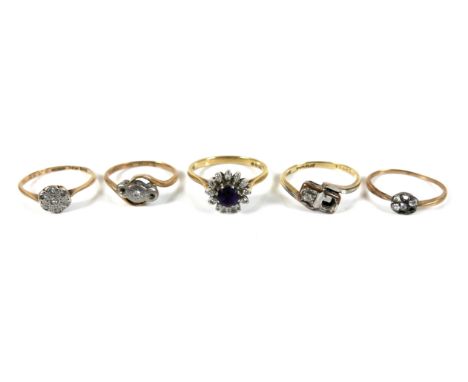 A group of five 18ct gold rings, in a variety of designs, sizes M, M, L, J, and K, total gross weight 11.1g. (5)