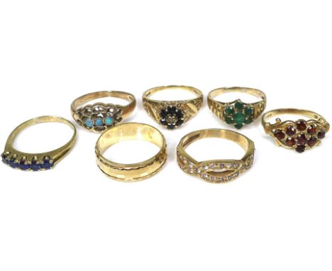 A group of seven 9ct gold rings, six set with stones including sapphire, opal and garnet, the seventh a faceted band, all siz